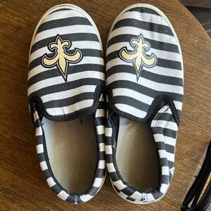 New Orleans Saints flat slip on shoes. Size 6, black and white striped.